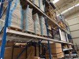 Packed conversion kit parts on warehouse shelves