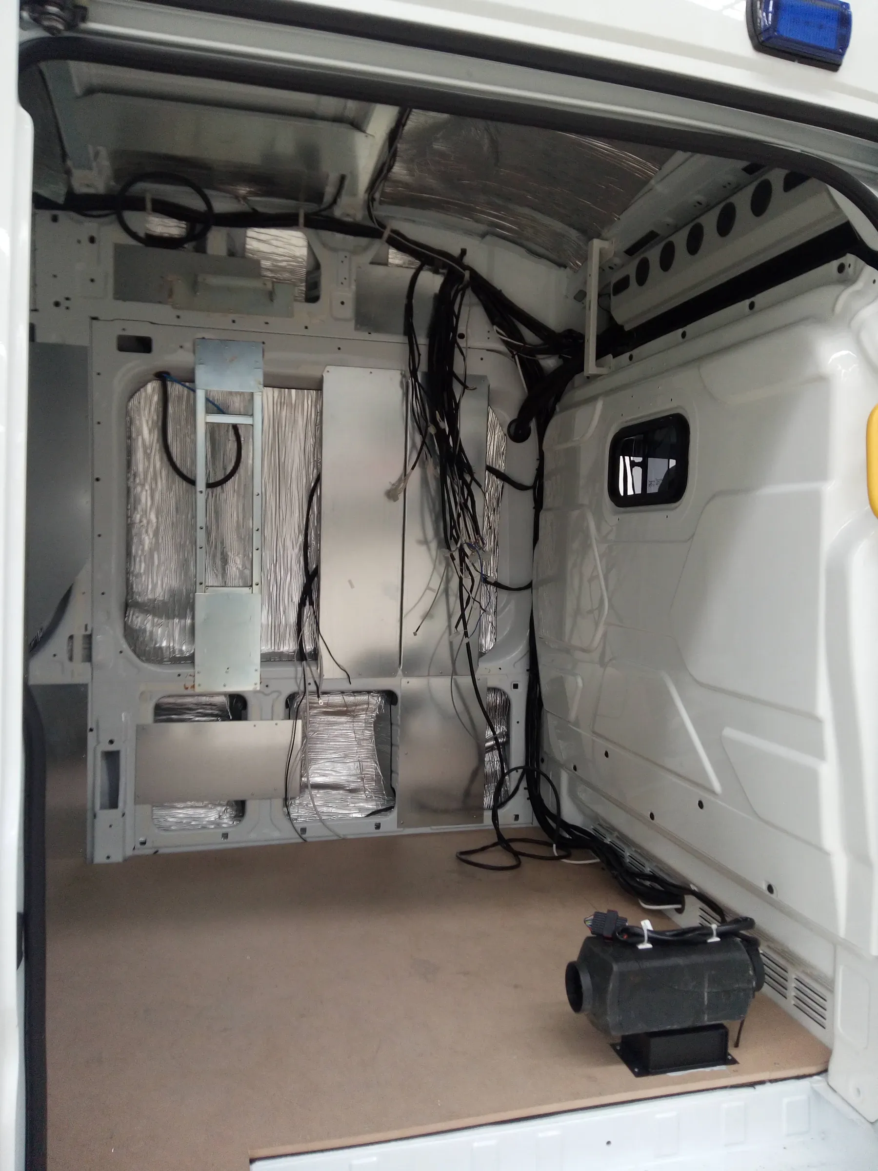 Patient compartment during assembly with wiring and floor installed