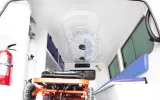 Attendant seat and fire extinguisher in the Land Cruiser ambulance patient compartment
