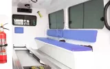 Side bench and stretcher platform in the Land Cruiser ambulance patient compartment